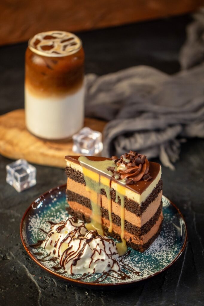Layered chocolate cake with an iced latte at Atez in Manhattan, New York