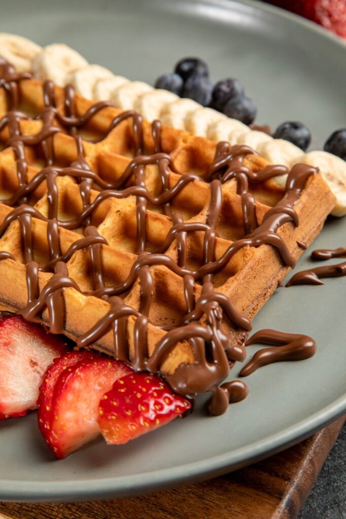 Belgian waffle with chocolate drizzle, strawberries and bananas at Bora Bora Café in Paterson, NJ
