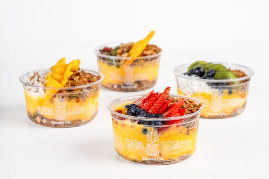 Mango smoothie bowls with granola and fresh fruit at Bora Bora Smoothie Cafe