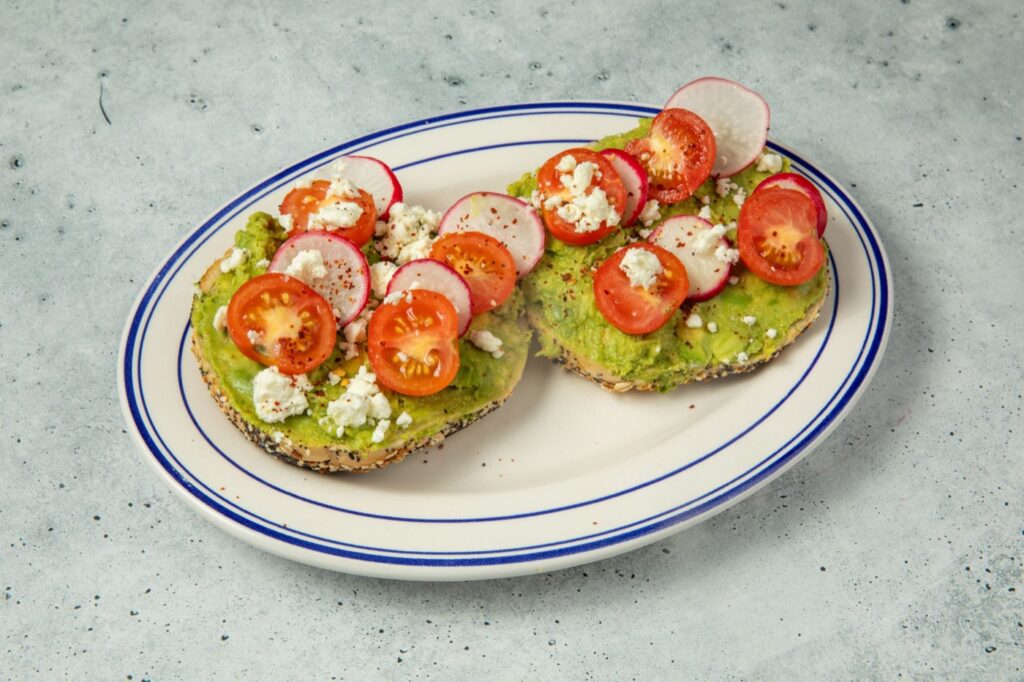 Avocado bagel with cherry tomatoes, radish and feta at Dough Bros in Williamsburg, Brooklyn
