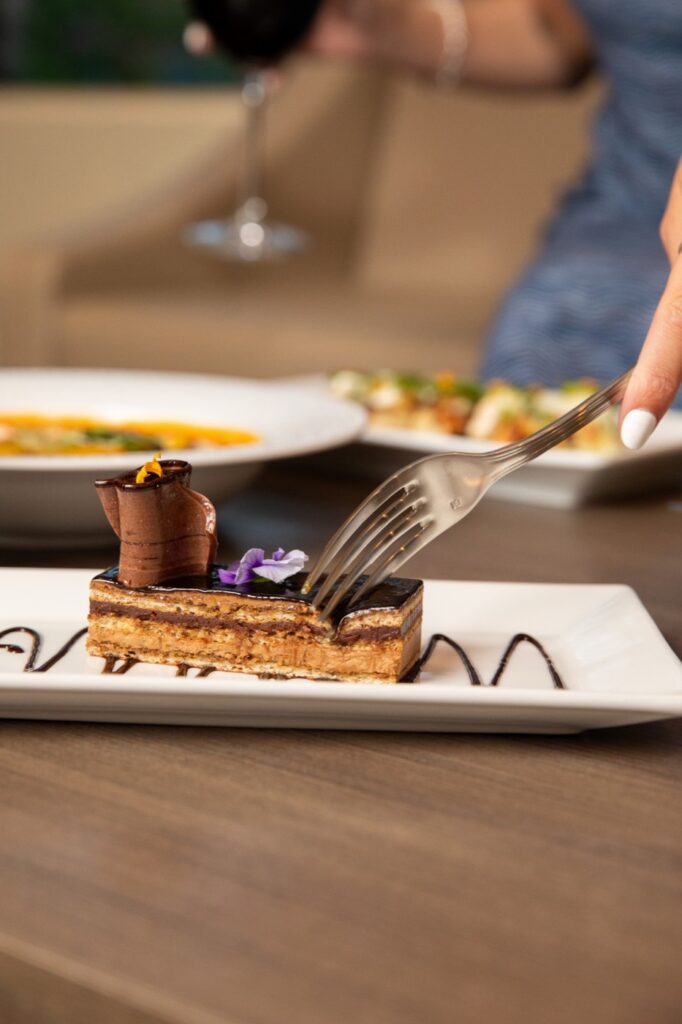 Layered chocolate opera cake dessert at Gauthaman's in Edison, NJ