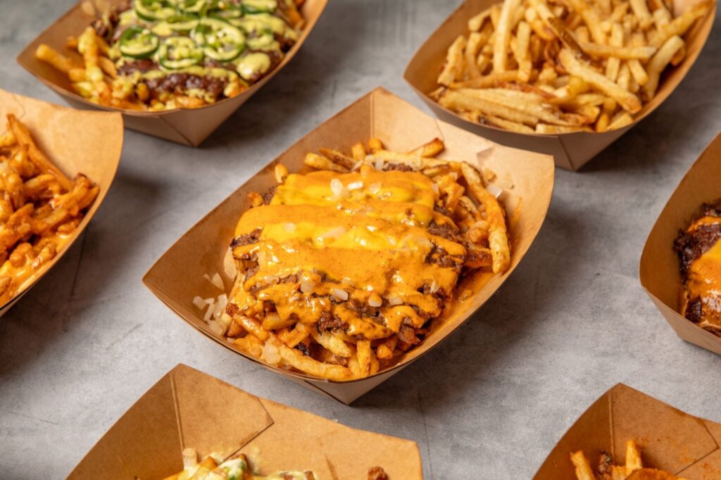 Lineup of loaded fries at Hitit Burger in Bayside, Queens
