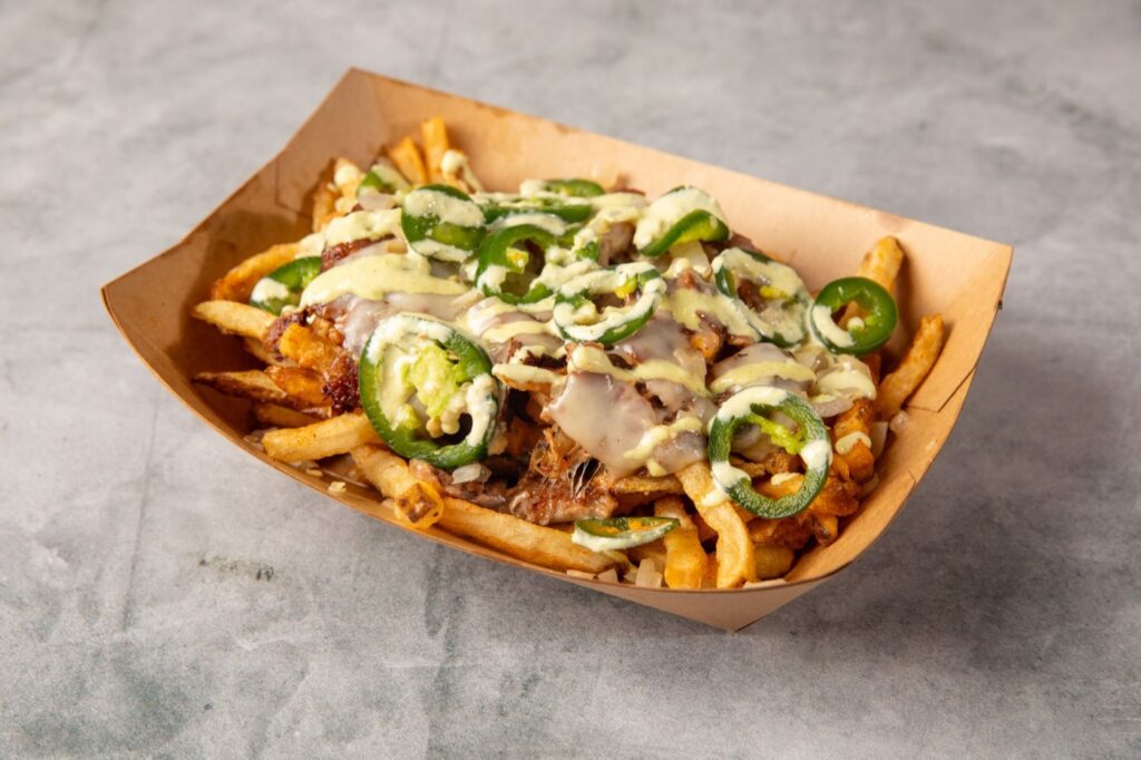 Loaded fries with jalapenos and herb sauce at Hitit Burger in Bayside, Queens