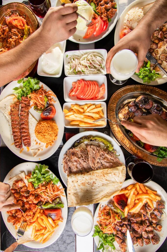 Overhead Turkish feast with Adana kebab, doner, and chicken shish at Istanbul Grill House in Paterson, NJ