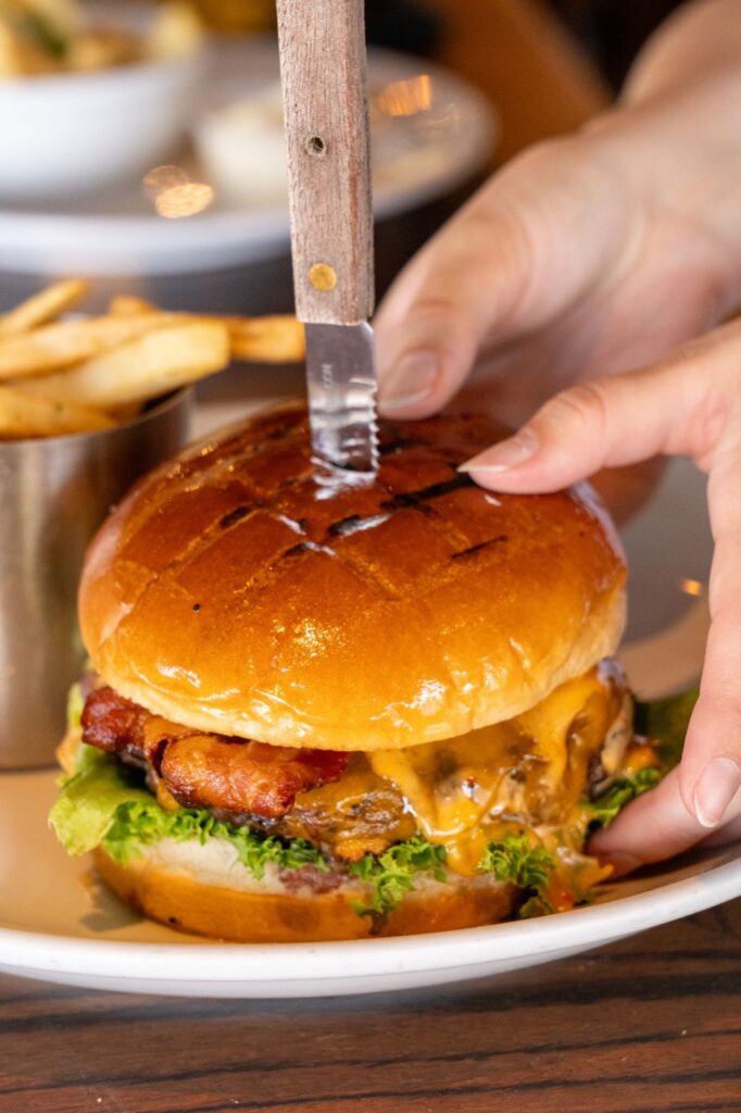 Bacon cheeseburger with fries at River Dock Cafe in Staten Island, NY