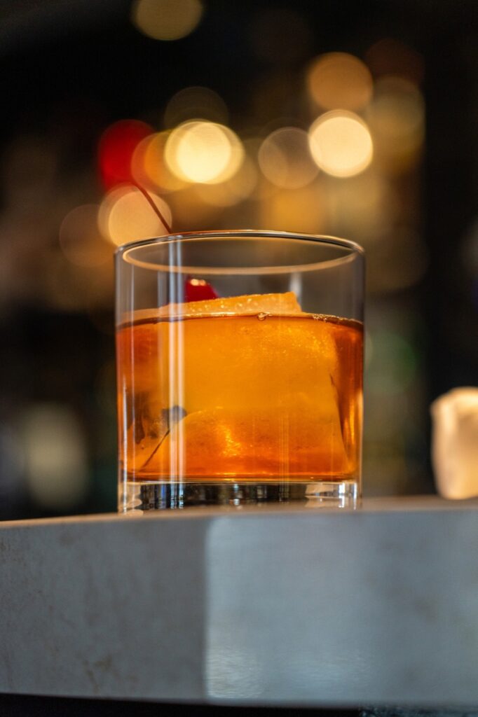 Old Fashioned cocktail with cherry at the bar at Tiffany in Manhattan, New York